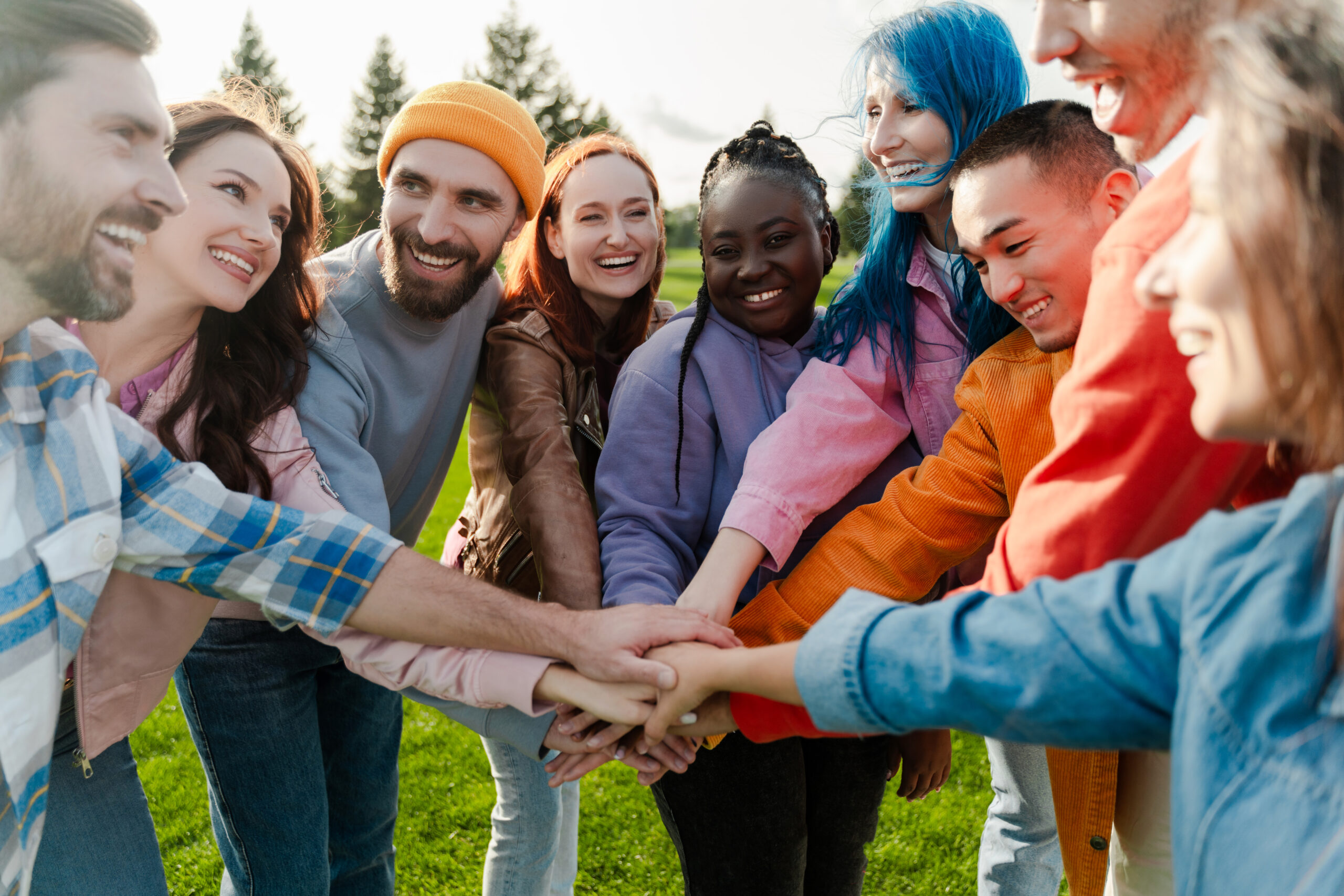 Vecteezy group of diverse people joining hands forming a circle outdoors 51963270